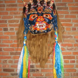 Mahakala - full view, acrylic on paper maché, hand beaded ornaments, horsehair, khadag (various colored silk) 35"x39"x9"