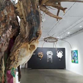 Lord of Divinity - detail (2010), tree bark, tree root, fabric installation, sheep skull, fabric transfer, 34”x55”x17”
