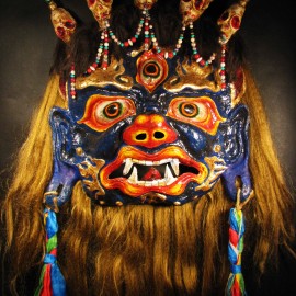 Mahakala, acrylic on paper maché, hand beaded ornaments, horsehair, khadag (various colored silk) 35"x39"x9"