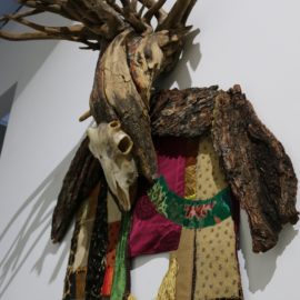 Lord of Divinity (2010), tree bark, tree root, fabric installation, sheep skull, fabric transfer, 34”x55”x17”